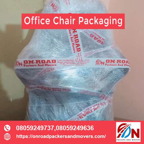 shifting an office chair through our packers and movers bangalore service after a tight packaging